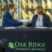 Hood Whitson, chief executive officer of Element3, and Cynthia Jenks, associate laboratory director for the Physical Sciences Directorate, shake hands