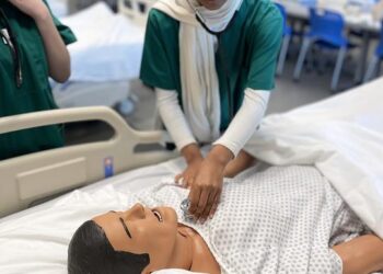 Students learned basic clinical skills including checking patient vital signs.