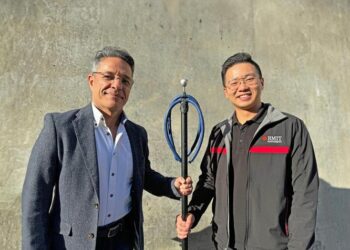 Lead researchers with their speargun device