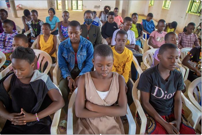 Ugandan female youth practicing Transcendental Meditation