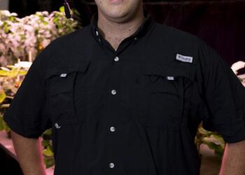 Ryan Dickson in greenhouse