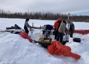 Sampling soil core near Fairbanks in winter