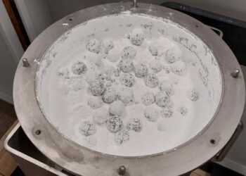 The co-crystal powder (rac-ibuprofennicotinamide) together with the milling balls IMPACTIVE