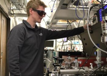 Clay Klein, working in his lab at JILA.