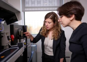 Ekaterina (Katya) Vinogradova, Ph.D., assistant professor at The Rockefeller University, collaborates with a colleague in her lab.