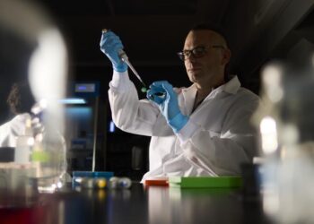 Assistant Professor Łukasz Sznajder works in his lab.