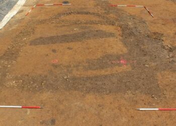 Excavated remains of a stone building with an apse