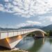 Passive radiative cooling paints bridge materials design and real-world performance