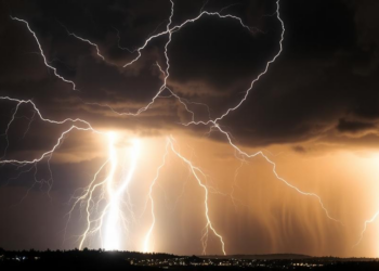 Cosmic-Ray Muons Reveal Gigavolt Electric Fields Hidden Inside Thunderstorms