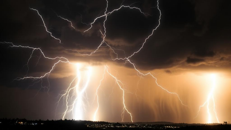 Cosmic-Ray Muons Reveal Gigavolt Electric Fields Hidden Inside Thunderstorms