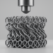 Twisting Metamaterial Turns Compression Into Self-Recovering Impact Protection