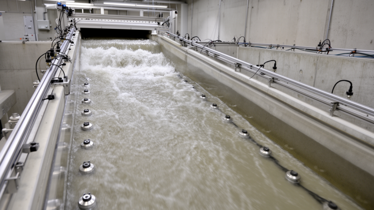 Flume study quantifies dam-break pressure on sloping wet beds