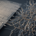Random Skin Wiring Beats Neat Layouts in Self-Calibrating Touch Circuits