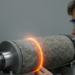 Thermoelastic Instability Sets a Limit to Sample-Size Effects in Rock Friction
