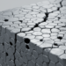 Voids and grain structure jointly weaken nanocrystalline steel in simulations