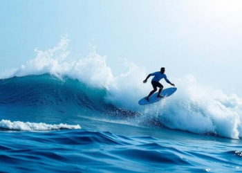 Cells Ride Chemical Waves Like Surfers to Move as One
