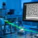 Picosecond Laser Pulse Energy Controls Nanostructure and Oxide Growth on Niobium–Titanium Multilayers