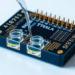 Tesla-Inspired Microfluidic Chip Mixes Fluids and Feeds Three Test Chambers Evenly