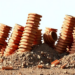 Tilted Piles Defy Their Bad Reputation by Stiffening Group Foundations Under Strong Shaking